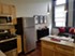 Principal - Living/Kitchen - Photo 4 of 6